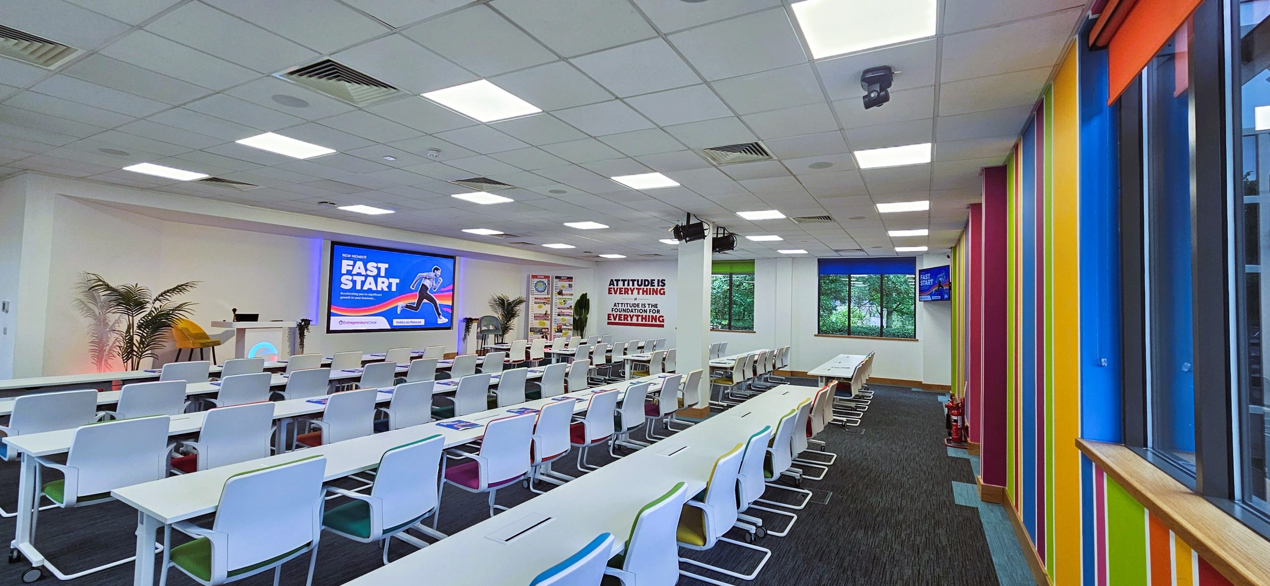 Entrepreneurs Circle training room set up for live sessions with AV displays and live streaming